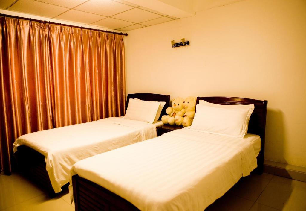 Sanya Hairulan Hotel Pokoj fotografie